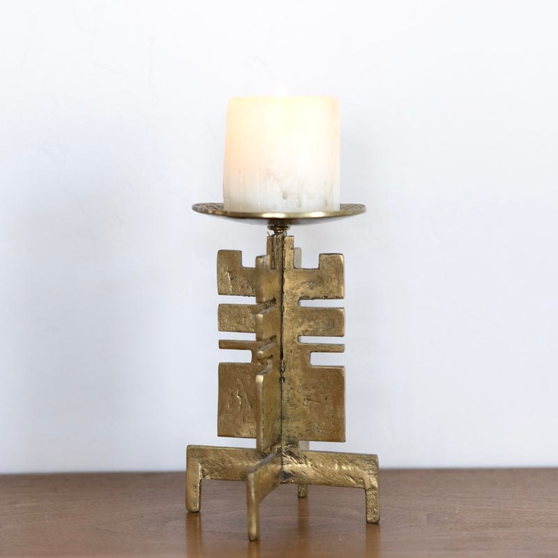 Sculptural brass candle holder