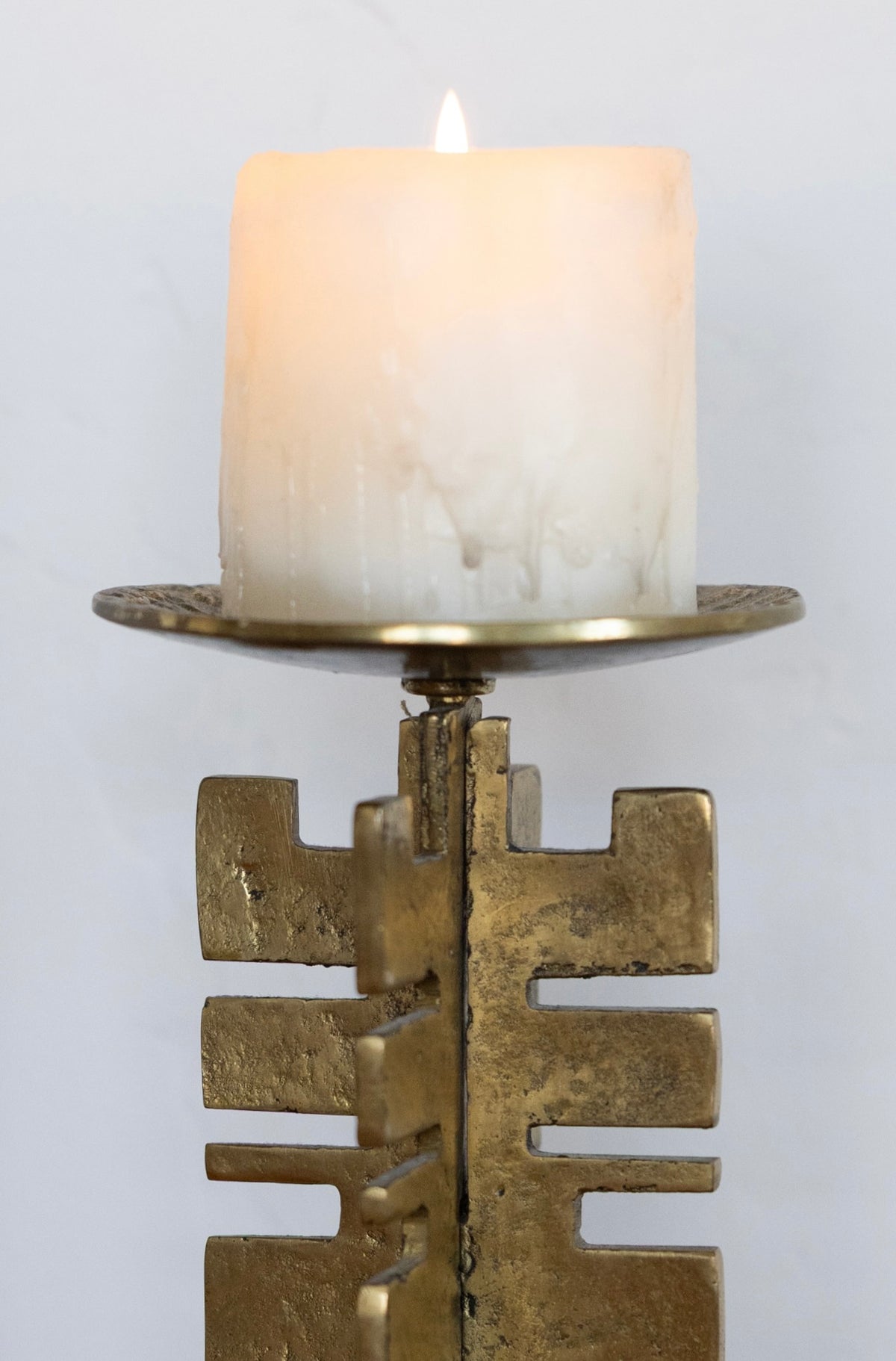 Sculptural brass candle holder