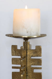 Sculptural brass candle holder