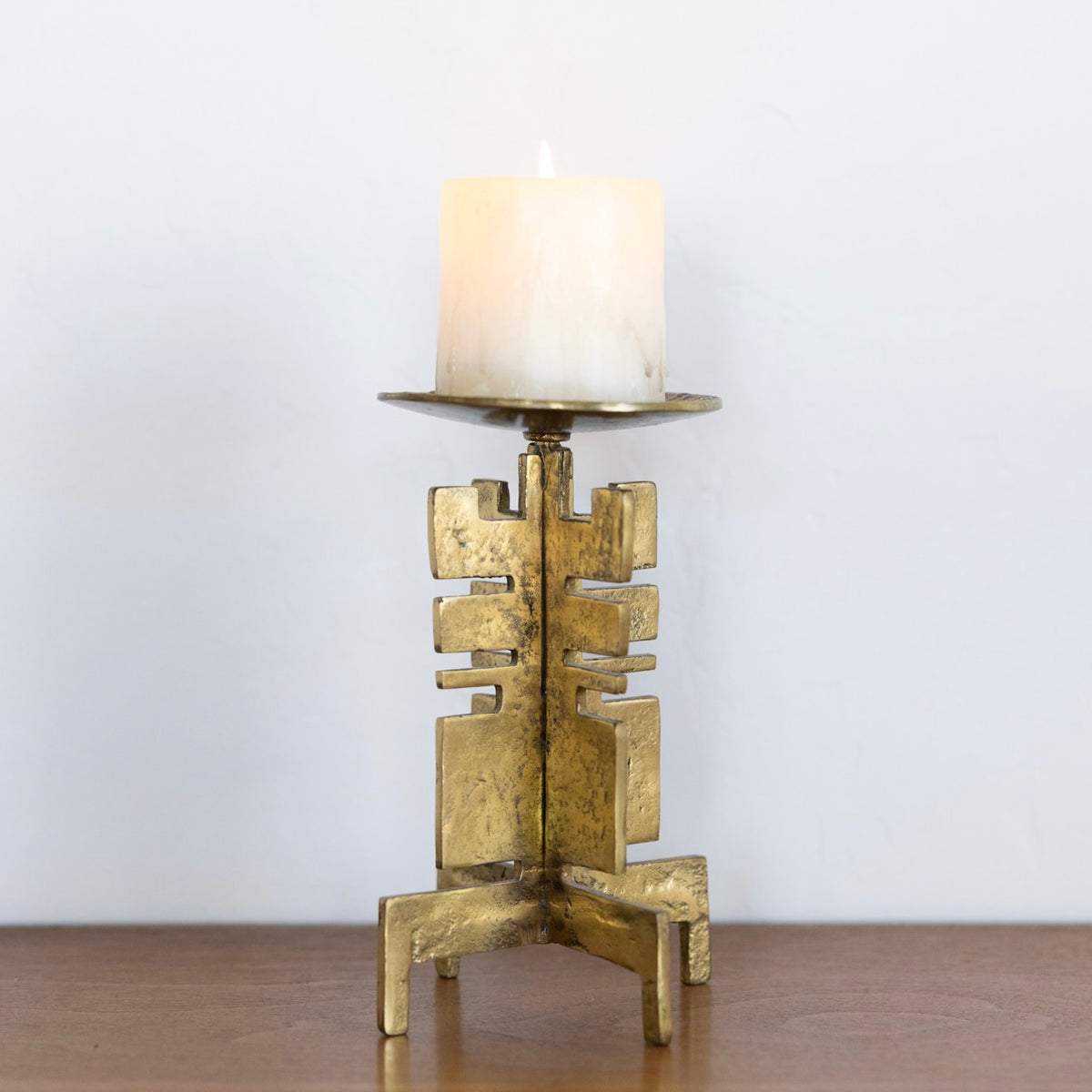 Sculptural brass candle holder
