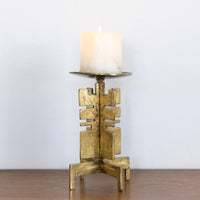 Sculptural brass candle holder