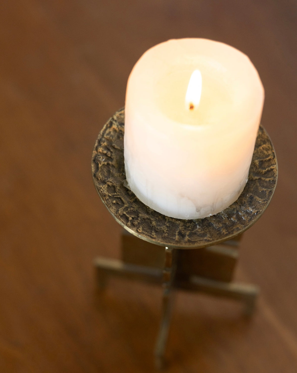 Sculptural brass candle holder