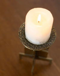 Sculptural brass candle holder