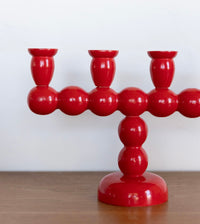 Long red bobbin candelabra
