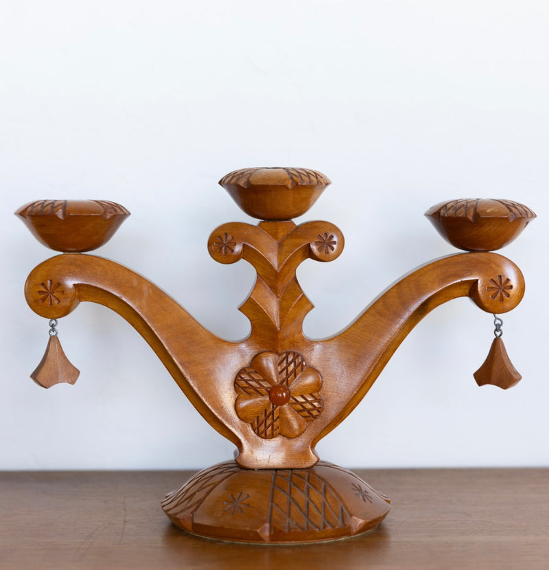 Carved folk art candelabra