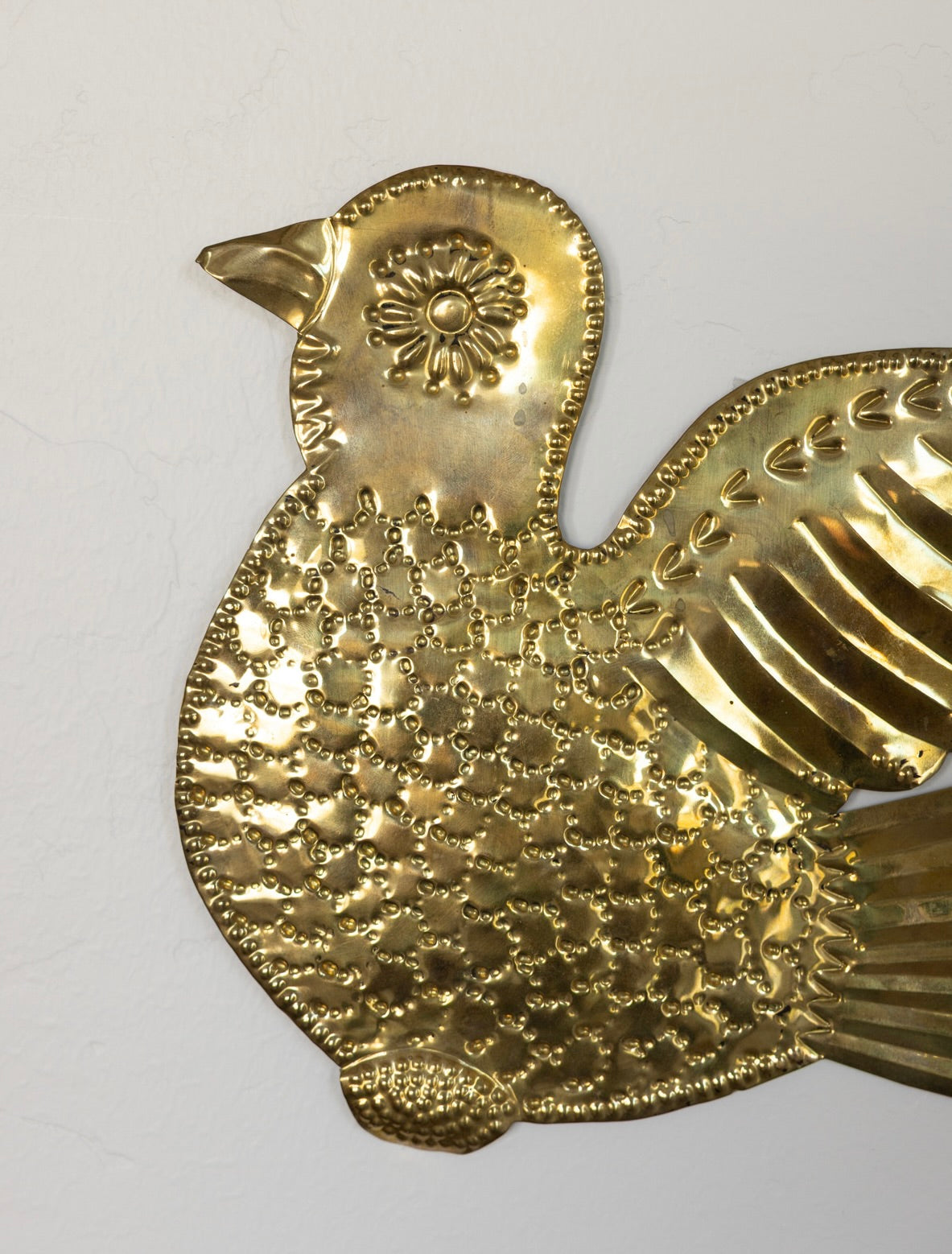 Embossed brass dove
