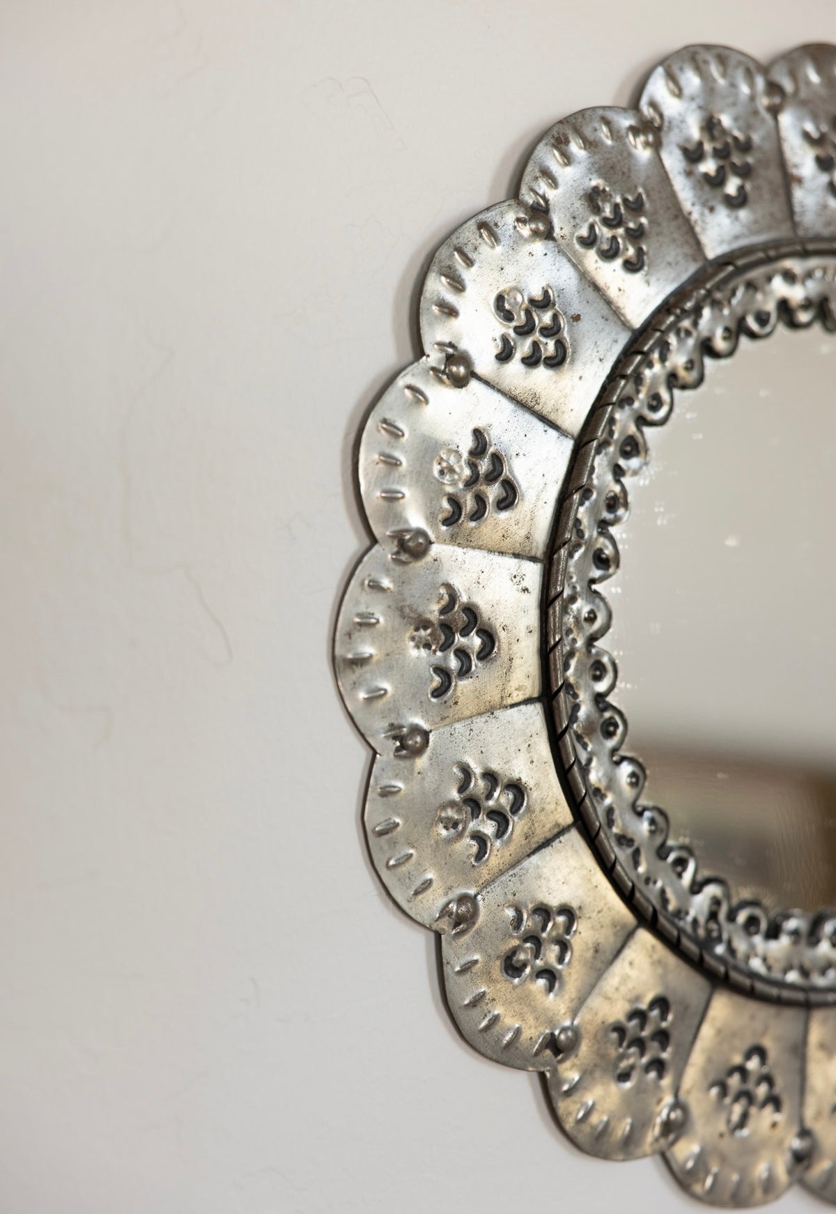 Scalloped punched tin mirror