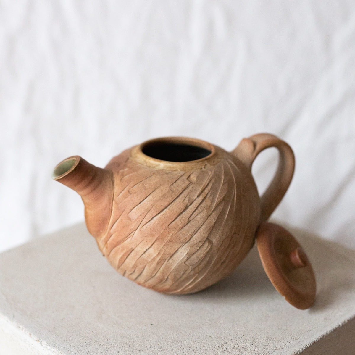 Carved clay teapot